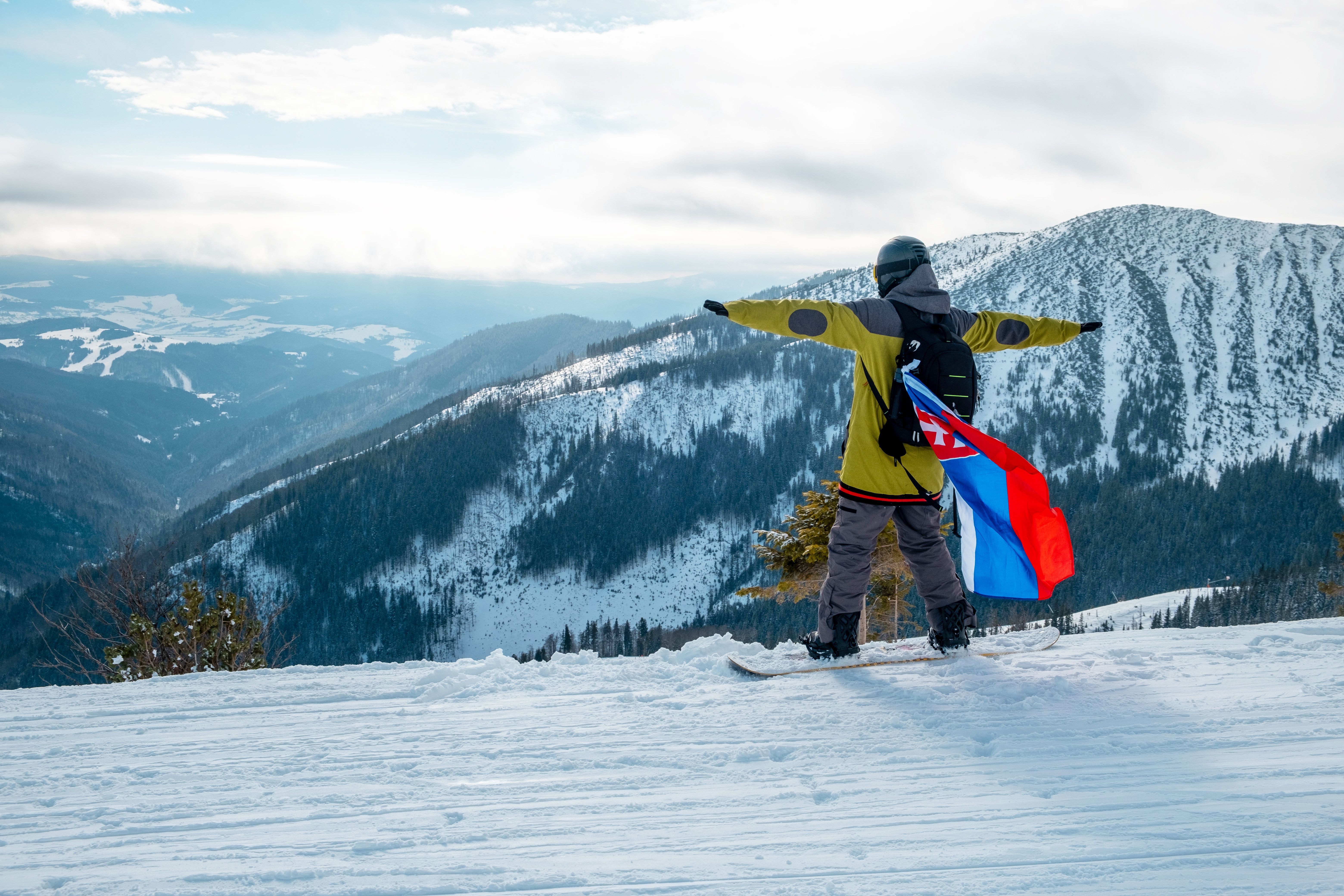 man-snowboarder-with-slovakia-flag-at-ski-resort-s-2025-03-08-04-39-26-utc.jpg